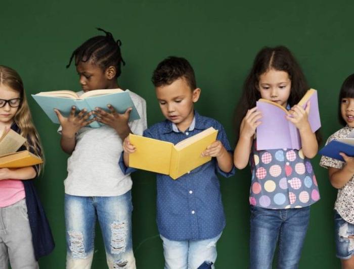 Children lined up and reading