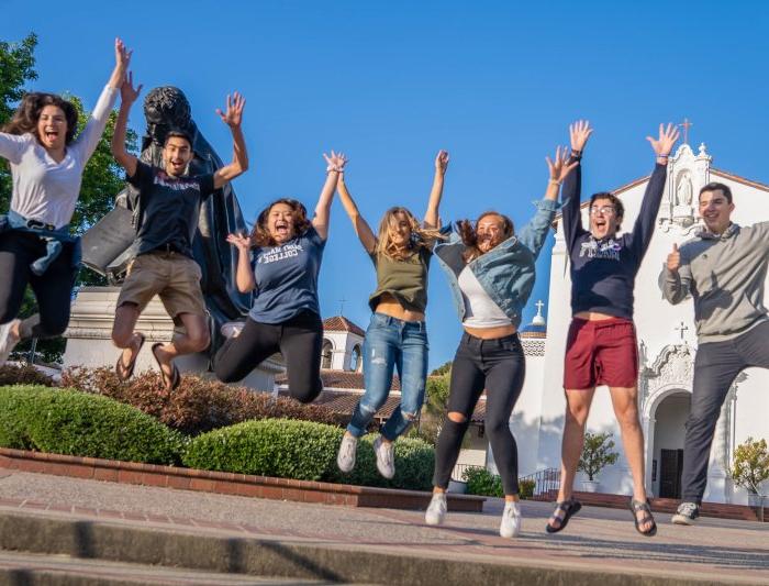 Saint Mary's Students Jumping in front of Chapel